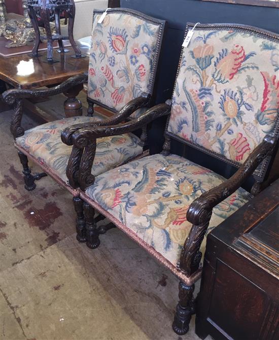 A pair of Louis XVI style carved and stained beech open armchairs,